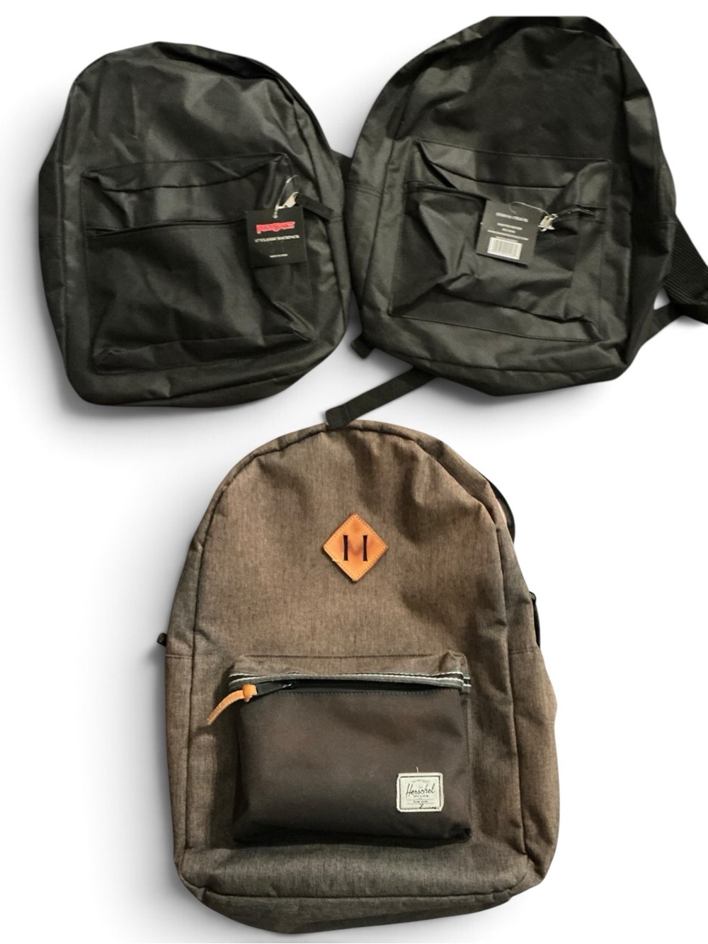 Bundle of 1 Brown Canvas Backpack like new and 2 new black backpacks